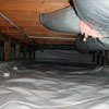 A sealed crawl space with an insulated hot air duct in Oakland.