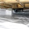 Bare floor joists in a sealed, insulated crawl space in Hayward.